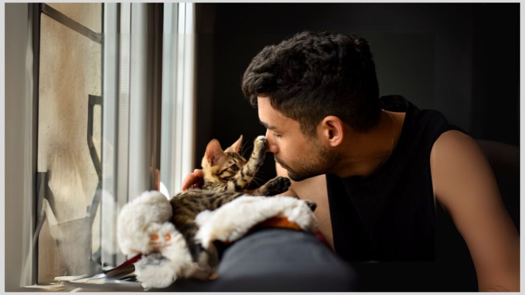 Man petting a cat. Parents of autistic children need self-care to be able to better care for their child.