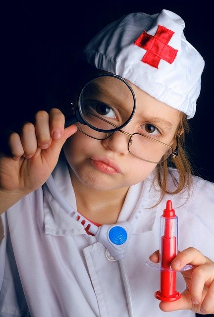 Girl dressed up as doctor. Create a dream team for your child with autism.