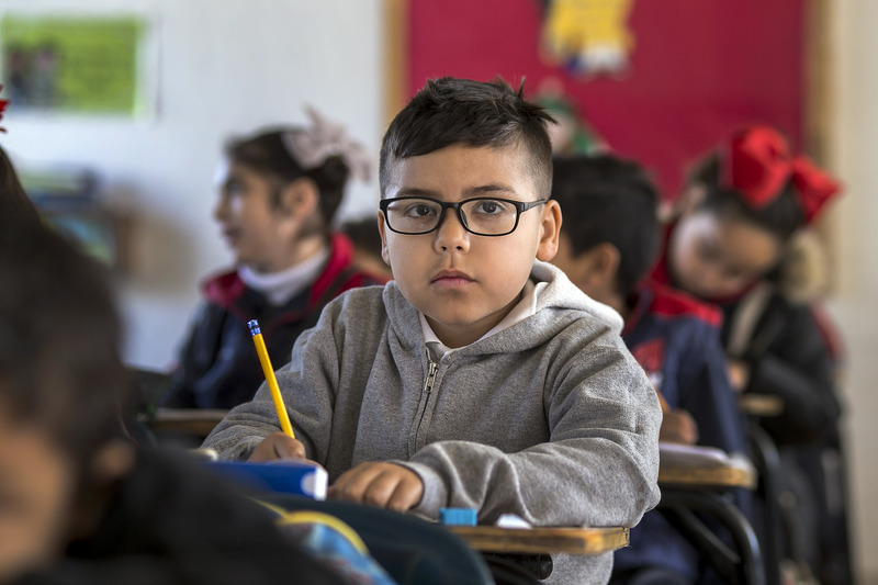 Boy in classroom. Prepare your child with autism/ADHD for a new school year.