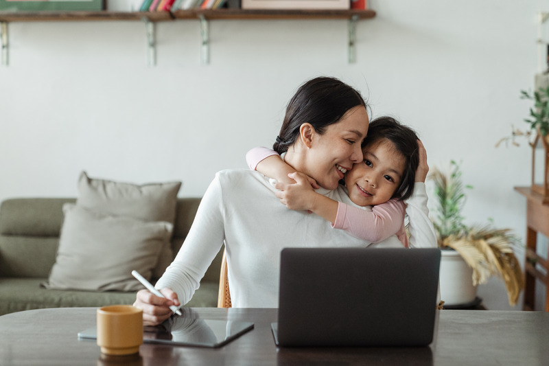 Mom working with child. You can work full time and raise a special needs child.