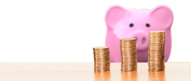 Piggy bank with coins. You can overcome the financial burden of autism.