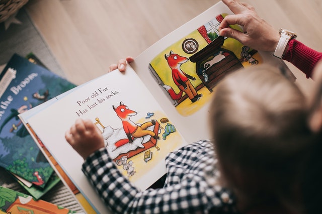 Child reading. Find childcare for your child with autism.