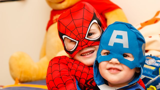 Two boys in superhero costumes. Should you join an autism support gorup?