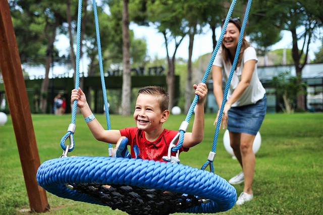 Boy swinging. Can occupational therapy help with autism?