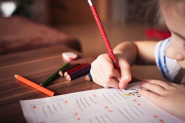 Child writing. Can occupational therapy help autism?