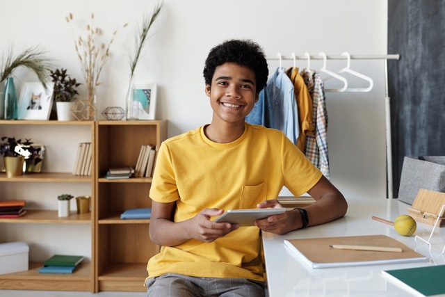 Boy sitting at desk.