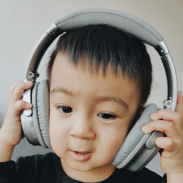 Boy wearing headphones. Helping your child with autism and ADHD manage sensory issues.