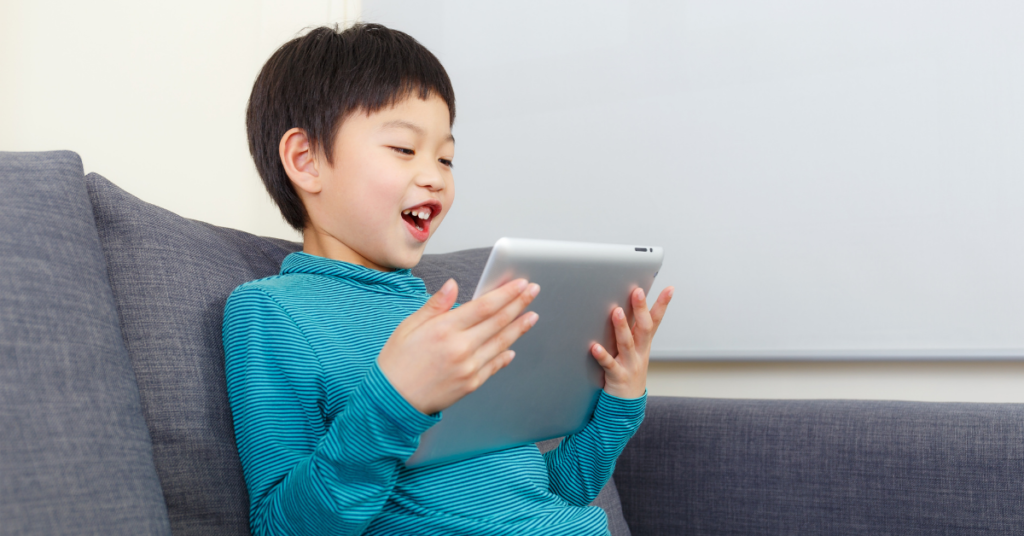  Boy on iPad. Can autism grants help your child?