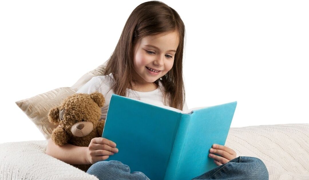 Little girl holding a book. Book review of children's book "ADHD and Me"