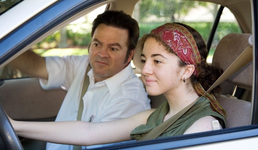 Teenage girl driving with instructor. Is your teen with autism and ADHD ready for driving?