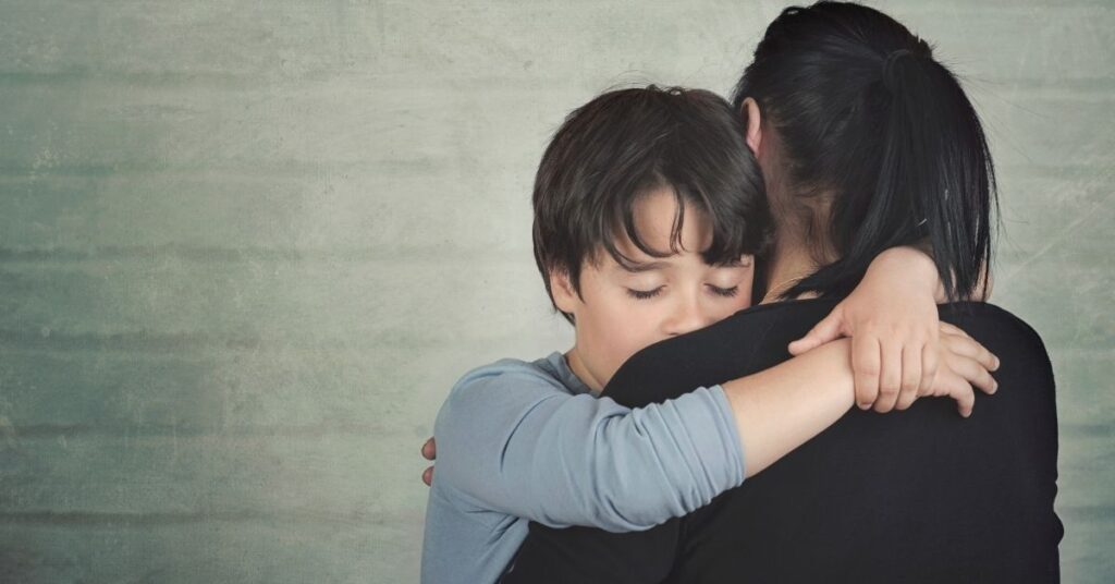 Boy hugging his mom. Could your child with autism and ADHD also have depression?