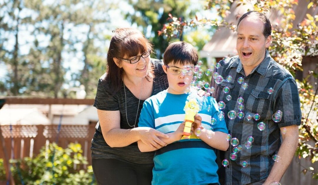 Parents with autistic boy watching bubbles