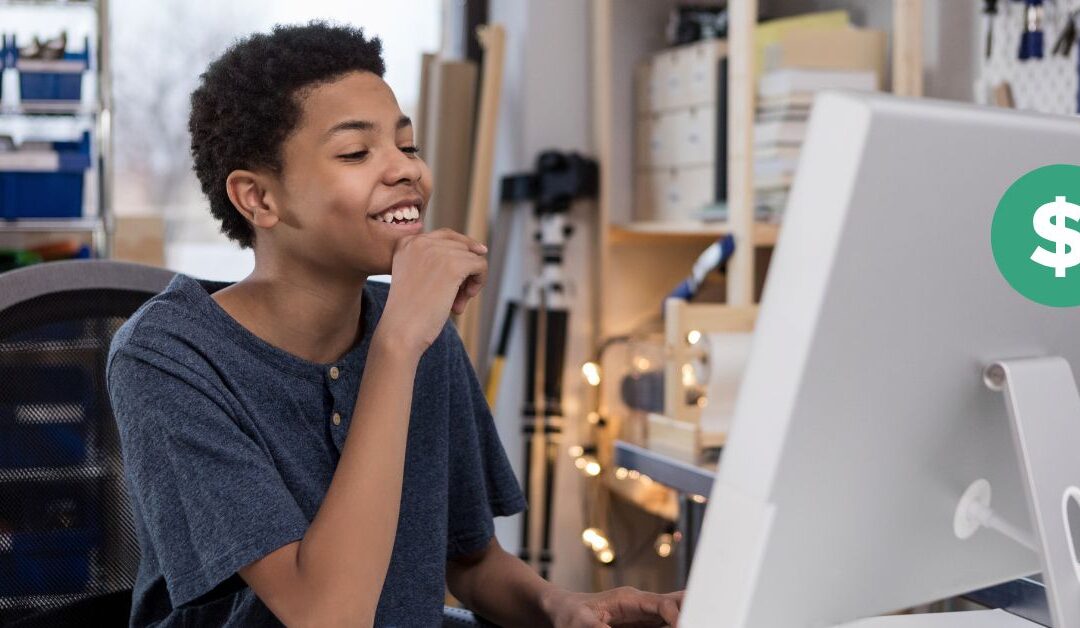 Teen boy looking at his computer