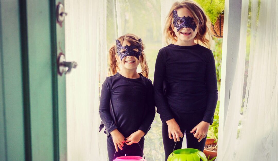 Two girls dressed as cats Trick-or-Treating