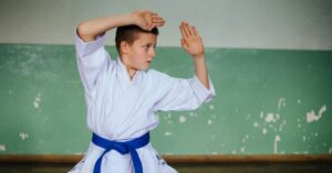 Boy in a karate stance. Can recreational therapy help your child with autism?