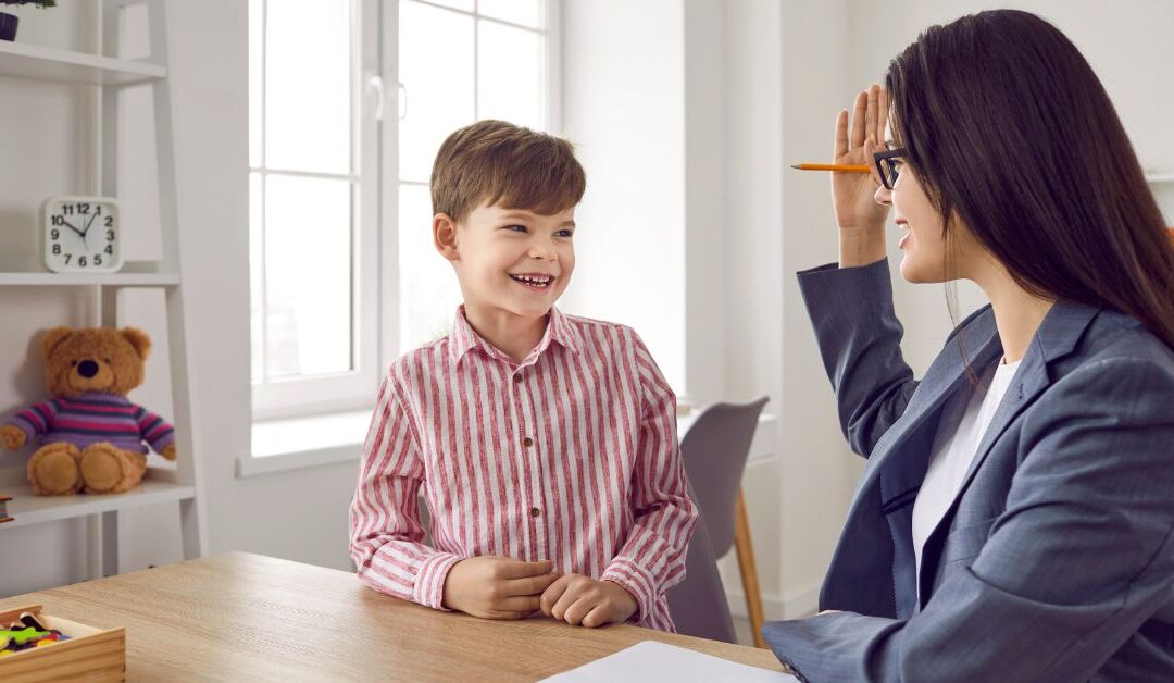 Boy talking to a psychologist during an autism evaluation
