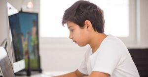 Boy focused on his computer