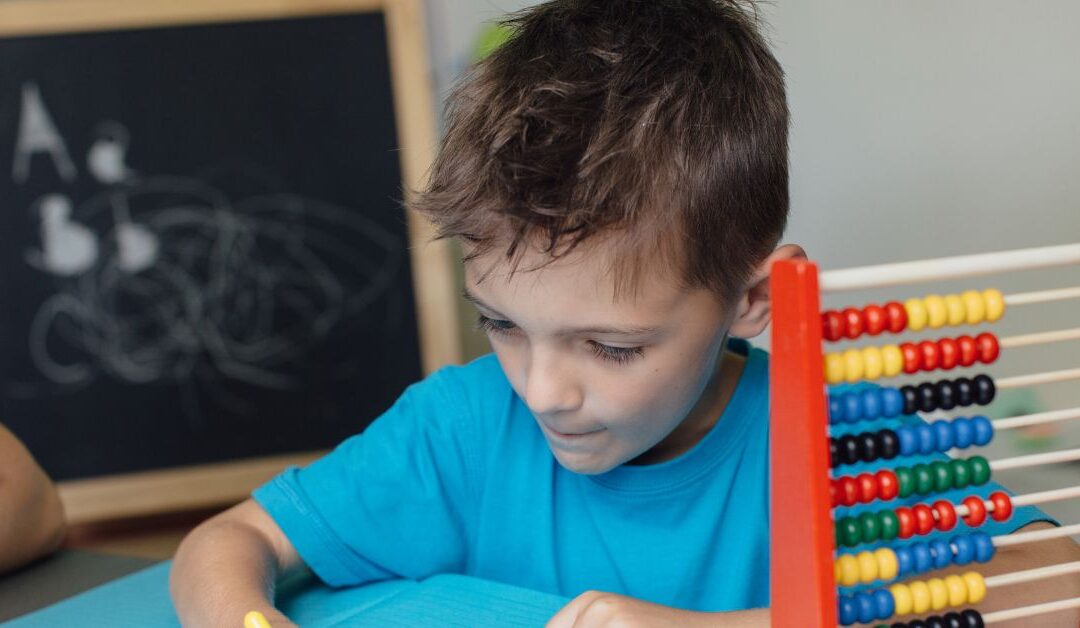 Boy with autism and ADHD hyperfocused on an activity. How can you help your child manage hyperfocus?