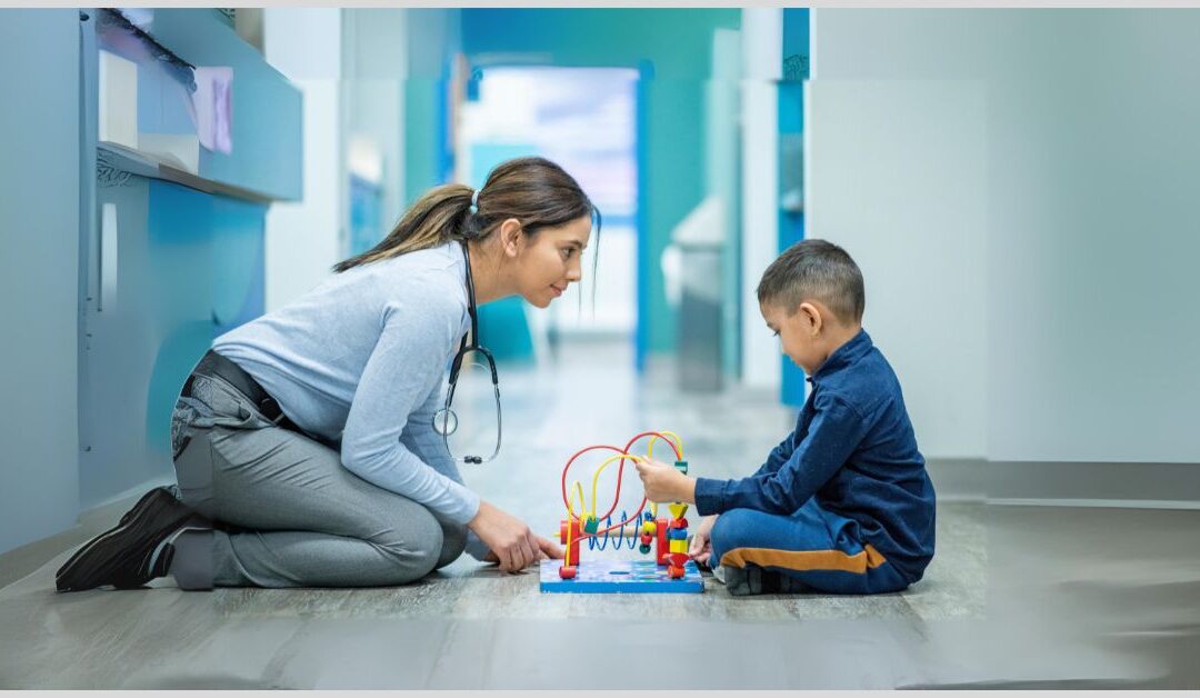Therapist working with an autistic boy