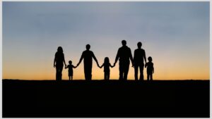 Silhouette of parents and children holding hands. It's important to have solidarity and connect with other parents of autistic/ADHD children